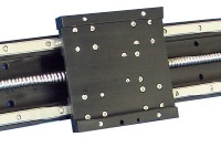 Top view of an XLA carriage running on the bearing blocks of the actuator and driven by a screw.